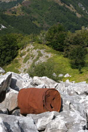 Environment pollution. Environmental pollution. Old rusty barrel abandoned in the stony ground. Stock photos. - MyVideoimage.com | Foto stock & Video footage