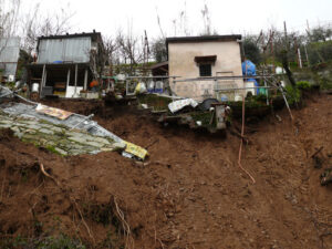 Environmental disaster. Environmental disaster due to climate change and human neglect. Landslide of land under buildings. - MyVideoimage.com | Foto stock & Video footage