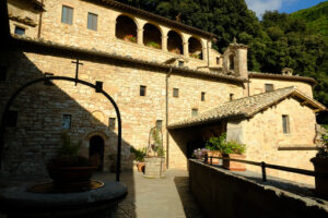 Eremo Assisi. Ritiro spirituale di San Francesco. Hermitage of the Carceri of Assisi where St. Francis retired to pray. Made of light stone it is placed inside a forest. - MyVideoimage.com | Foto stock & Video footage