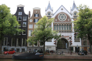 Facade of a neo-gothic church next to characteristic Dutch brick - MyVideoimage.com