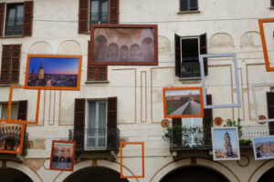 Facade with photo. Frames with photographs hanging outside. Stock photos. - MyVideoimage.com | Foto stock & Video footage