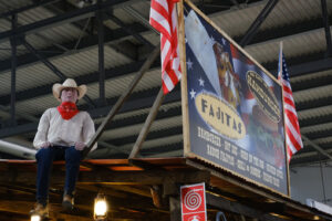 Fast food signboard with cowboy puppet. Milan Craft Fair. - MyVideoimage.com