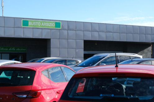 Ferrovie Nord Milano railway station in Busto Arsizio. First floor with parking of cars. Foto automobili. Cars photos.