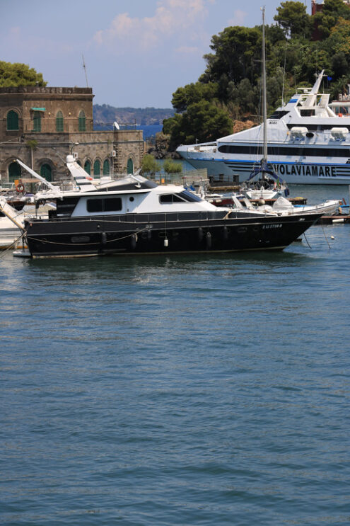 Ferry boat enters the port. The port of Ischia is housed in an a - MyVideoimage.com