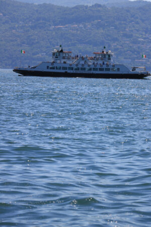 Ferry boat plows the waters of Lake Maggiore. In the background - MyVideoimage.com