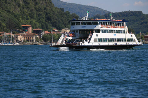 Ferry boat plows the waters of Lake Maggiore. In the background - MyVideoimage.com