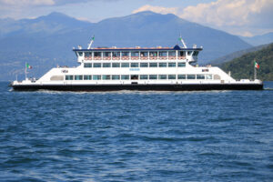 Ferry boat plows the waters of Lake Maggiore. In the background - MyVideoimage.com