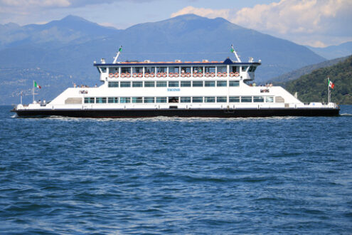 Ferry boat plows the waters of Lake Maggiore. In the background - MyVideoimage.com