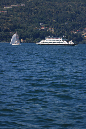 Ferry boat plows the waters of Lake Maggiore. In the background - MyVideoimage.com