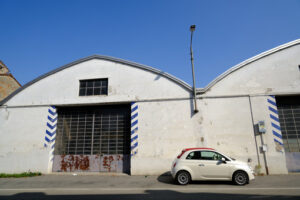 Fiat 500 new model. Fiat 500 new model parked in front of workshop. Stock photos. - MyVideoimage.com | Foto stock & Video footage