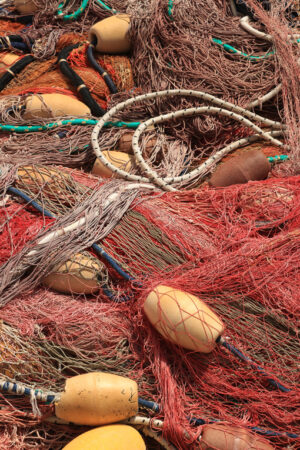 Fishing net. Fishing net stacked in the harbor. - MyVideoimage.com | Foto stock & Video footage