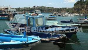 Footage boats. Boats anchored in the port of Corricella on the Island of Procida.  Video footage. - MyVideoimage.com | Foto stock & Video footage