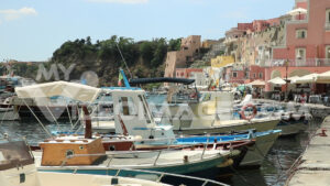 Footage fishing boats. Boats anchored in the port of Corricella on the Island of Procida.  Video footage. - MyVideoimage.com | Foto stock & Video footage