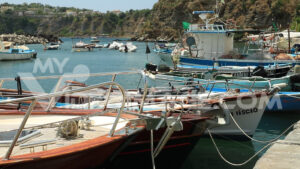 Footage fishing boats. Boats anchored in the port of Corricella on the Island of Procida.  Video footage. - MyVideoimage.com | Foto stock & Video footage