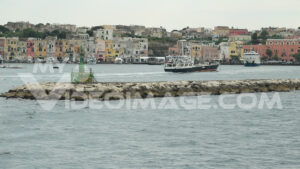 Footage landing people. Small passenger ship enters the port of Procida, Mediterranean Sea.  Video footage. - MyVideoimage.com | Foto stock & Video footage