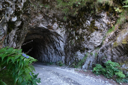 Galleria. Gallery carved into the rock. Dirt road tunnel. In the mountains of the Apuan Alps. - MyVideoimage.com | Foto stock & Video footage