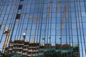 Glass facade. Glass facade of a building with reflection. Building sites. Photo stock royalty free - MyVideoimage.com | Foto stock & Video footage