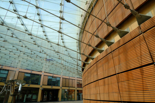 Glass roofed building. Modern building with glass roof and brick facade. Stock photos. - MyVideoimage.com | Foto stock & Video footage