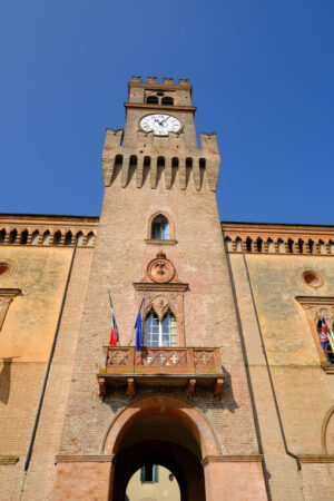 Gothic tower in Busseto. Neo-Gothic tower with clock built in red bricks. Stock photos. - MyVideoimage.com | Foto stock & Video footage