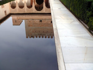 Granada, Spain. Facade reflections on a water basin in the Alhambra. Granada foto. Granada photo