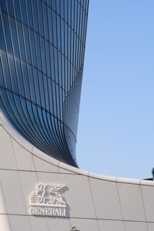 Grattacieli Milano Citylife. Assicurazioni Generali tower with sign logo. Three towers. Milan. CityLife includes three skyscrapers and pedestrian areas with greenery. - MyVideoimage.com | Foto stock & Video footage