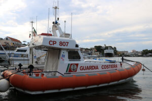 Guardia costiera. Coast Guard boat anchored in the port of Ischia, near Naples. - MyVideoimage.com | Foto stock & Video footage