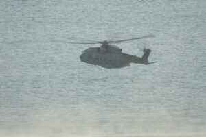 Helicopter. Helicopter on a rescue mission at sea during exercise. Stock photos. - MyVideoimage.com | Foto stock & Video footage