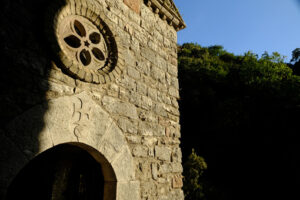 Hermitage of the Carceri of Assisi where St. Francis retired to pray. Small church with a rose window  within the architectural complex. - MyVideoimage.com