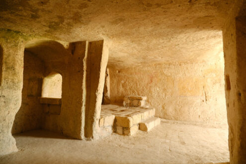 House in a cave. Sassi of Matera with arched ceilings and vaults. Doors and windows in an ancient underground house dug out of the tufa rock. - MyVideoimage.com | Foto stock & Video footage