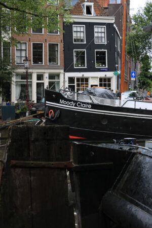 Houseboats and boats in an Amsterdam canal. Boats converted into - MyVideoimage.com