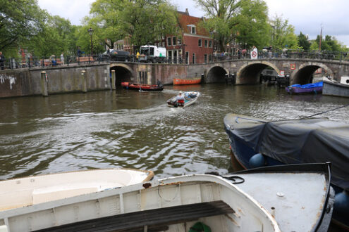 Houseboats and boats in an Amsterdam canal. Boats converted into - MyVideoimage.com