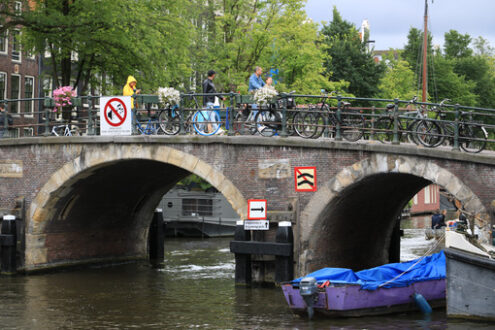 Houseboats and boats in an Amsterdam canal. Boats converted into - MyVideoimage.com