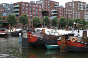 Houseboats and contemporary architecture in Amsterdam. Boats con - MyVideoimage.com