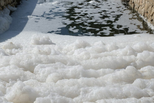 Inquinamento acqua. Pollution of a channel caused by surfactants. Foto stock royalty free. - MyVideoimage.com | Foto stock & Video footage