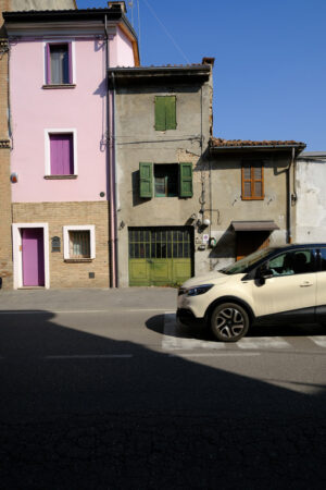 Italian houses. Old terraced houses along a street. Stock photos. - MyVideoimage.com | Foto stock & Video footage