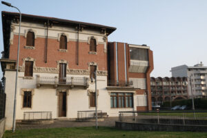 Italian liberty building. Recently refurbished and extended building with a red brick construction. - MyVideoimage.com | Foto stock & Video footage