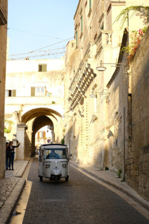 Italian taxi Ape Piaggio. Taxi Ape Calessino Piaggio in a street of the city of Matera. Motorcycle turned into an auto-taxi suitable for the streets of the Italian town. - MyVideoimage.com | Foto stock & Video footage