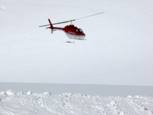 Jungfrau, Switzerlan, 08/06/2009. Red helicopter on high mountai - MyVideoimage.com