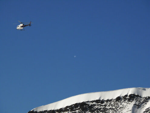 Jungfrau, Switzerland. 08/06/2009. A helicopter flies over the mountain . Foto Svizzera. Switzerland photo