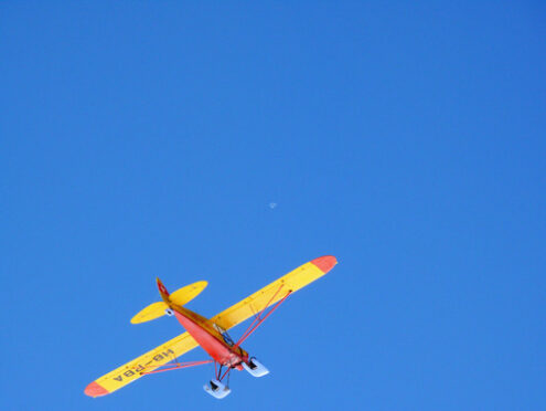 Jungfrau, Switzerland. 08/06/2009. Tourist plane in the blue sky. Foto aereo. Airplane photos