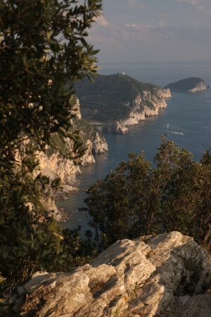 Liguria landscape. Mountains overlooking the sea near the Cinque Terre. In the background the church of Portovenere. - MyVideoimage.com | Foto stock & Video footage