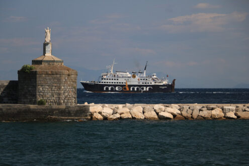 Madonna statue. Port of the island of Procida with a ferry and a statue of the M - MyVideoimage.com | Foto stock & Video footage