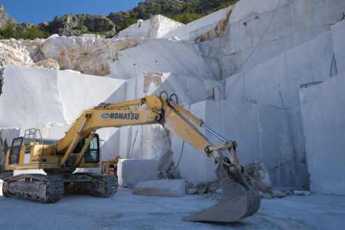 Marble excavation in quarry. Crawler excavator in a marble quarry near Carrara. Stock photos. - MyVideoimage.com | Foto stock & Video footage