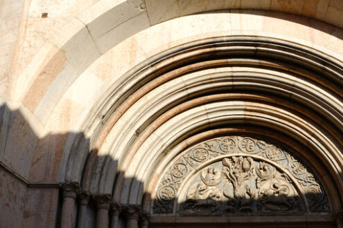 Marble portal of the baptistery of Parma. The building has an external façade built in pink Verona marble. - MyVideoimage.com