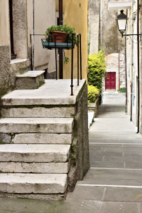 Marble staircase in Colonnata. Street of the ancient village of Colonnata, famous for the production of lard. The ancient village of white marble quarrymen is located above Carrara, in northern Tuscany. - MyVideoimage.com | Foto stock & Video footage