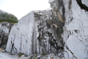 Marble wall. Carrara white marble wall. Rough natural marble surface in a quarry. Stock photos. - MyVideoimage.com | Foto stock & Video footage