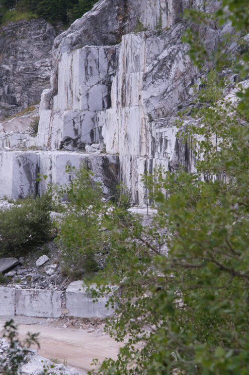 Marble wall. Wall of a white marble quarry under the mountain. Stock photos. - MyVideoimage.com | Foto stock & Video footage