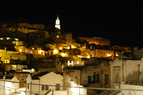 Matera by night. Sassi. Night illumination of the ancient city of Matera. Houses made of blocks of tufa stone. - MyVideoimage.com | Foto stock & Video footage