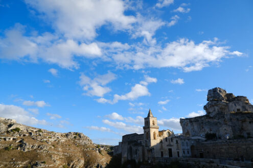 Matera church. Church of San Pietro Caveoso in Matera. In the background the Mountains with ancient prehistoric caves. - MyVideoimage.com | Foto stock & Video footage