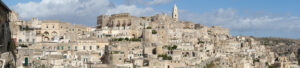 Matera panorama. Panoramic photography of the houses and the Sassi of Matera with the roofs and the streets. Blue sky with - MyVideoimage.com | Foto stock & Video footage